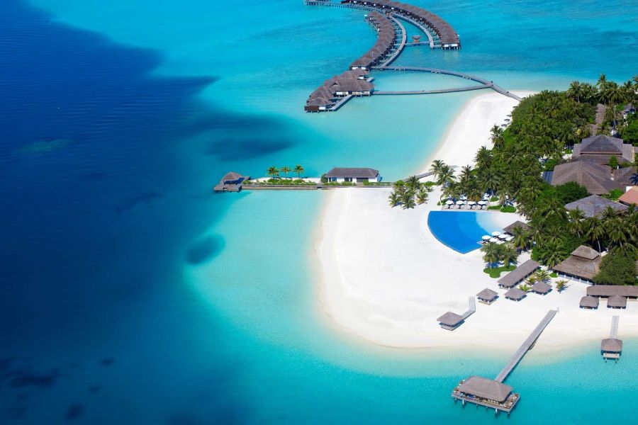 a beautiful image of cottages in Maldives beach